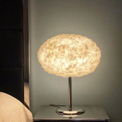 A cloud table lamp at the bed side